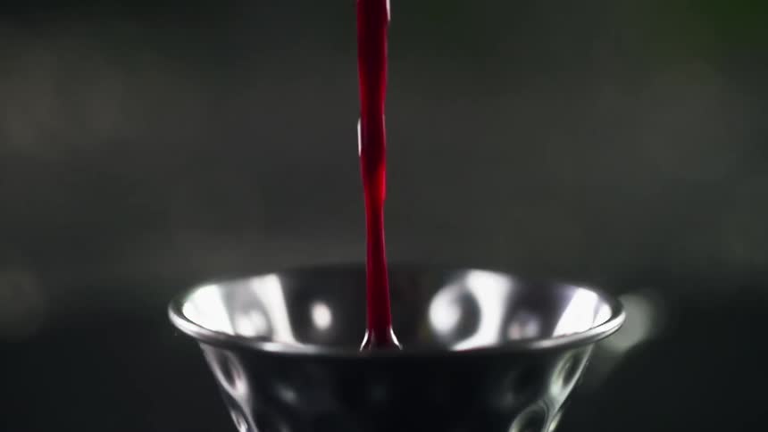 Cranberry sauce is poured into the small bowl