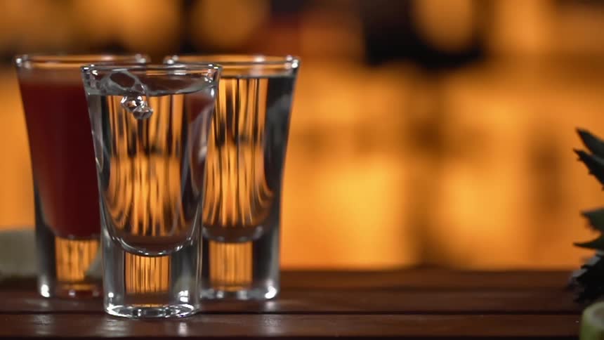Shot glasses filled with liquor for a photo shoot