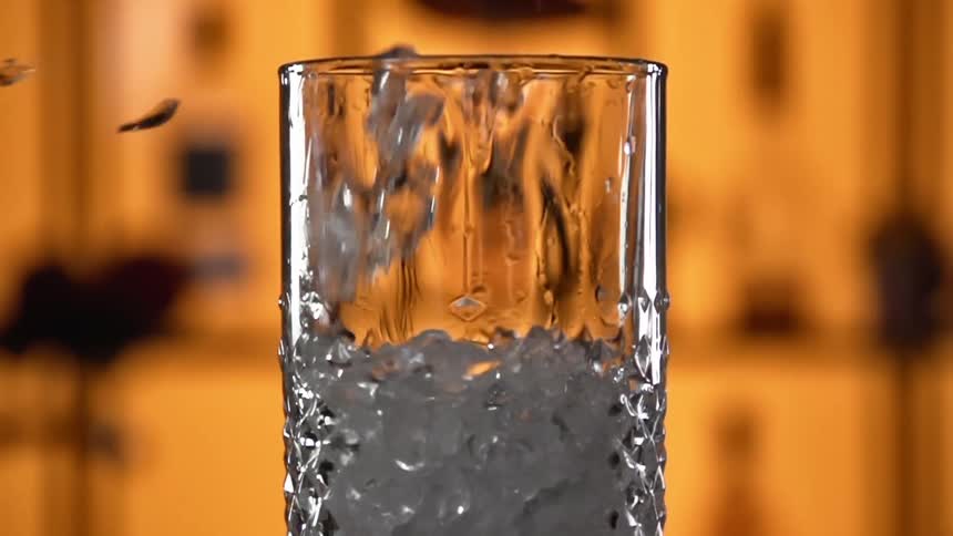 Ice being poured into a glass