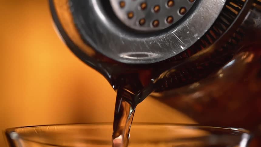 Water is slowly poured into a glass