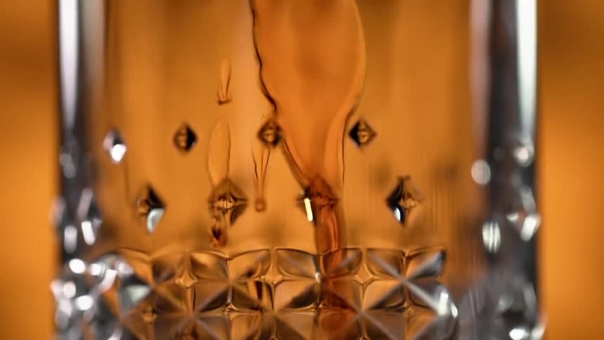 A beverage being poured in to a glass