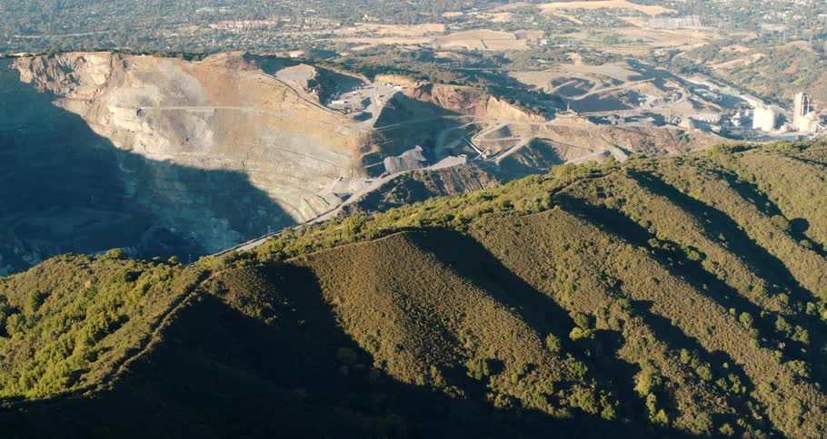 Aerial view of an open mine quarry between the mountains