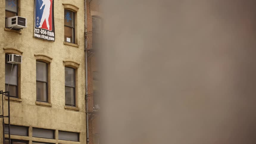 Buildings in the city with fire escapes and windows