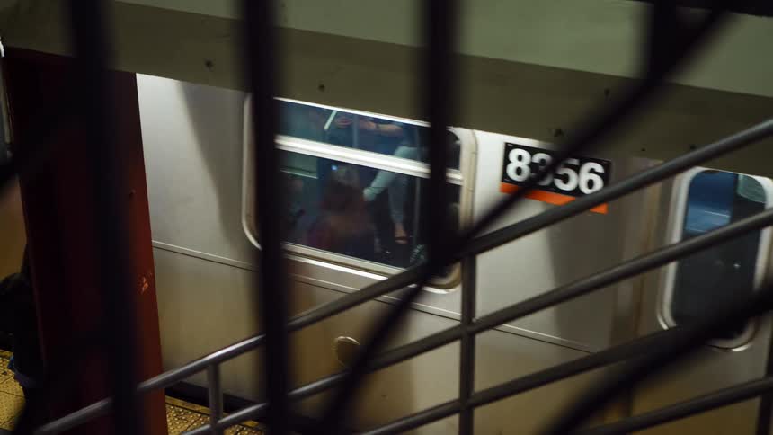 Train with passengers arrives at a metro station