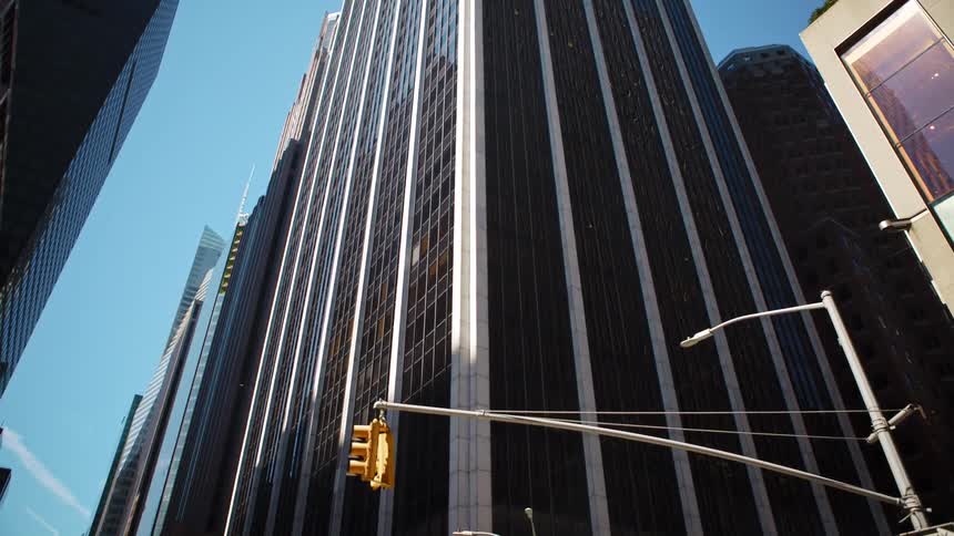 City street with tall office building in downtown on a sunny day
