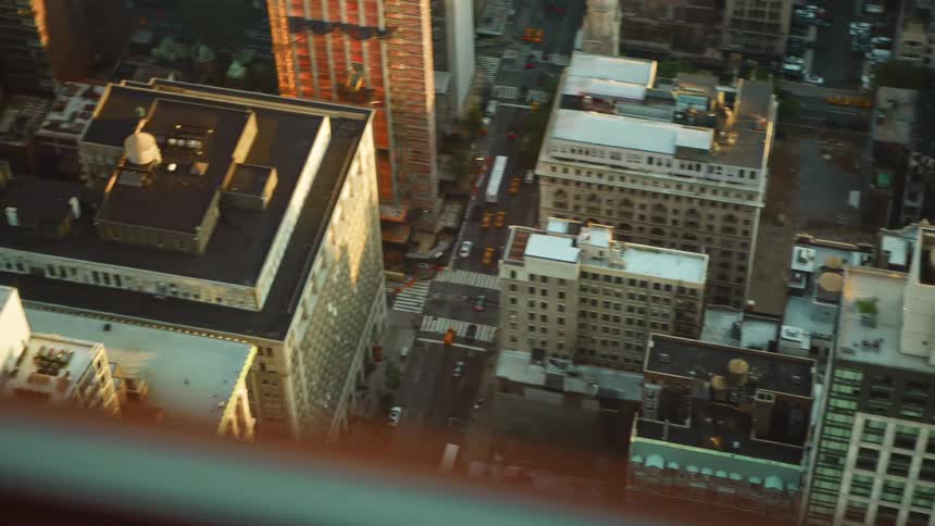 Aerial view of office buildings and car driving in a city