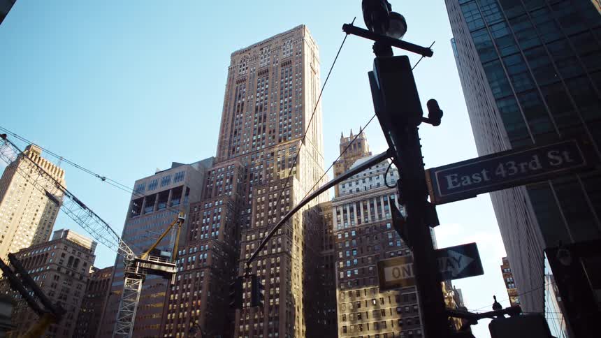 City street with tall buildings in the late afternoon