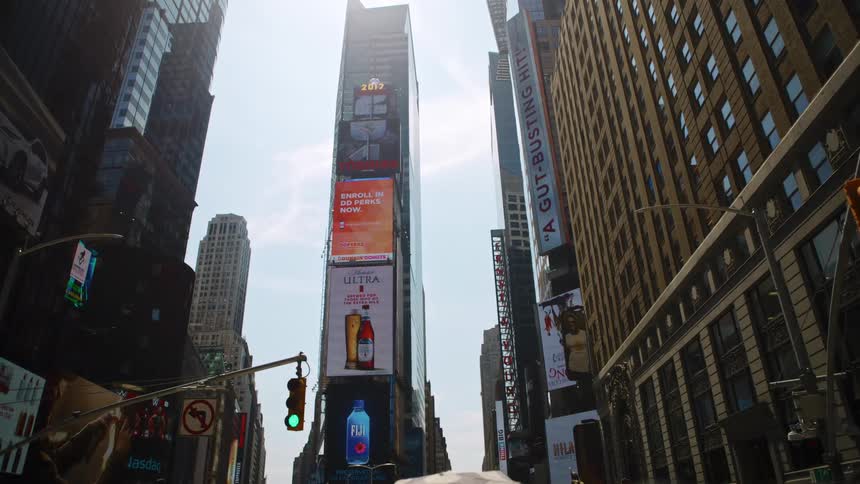 City street and tall buildings with billboards in downtown