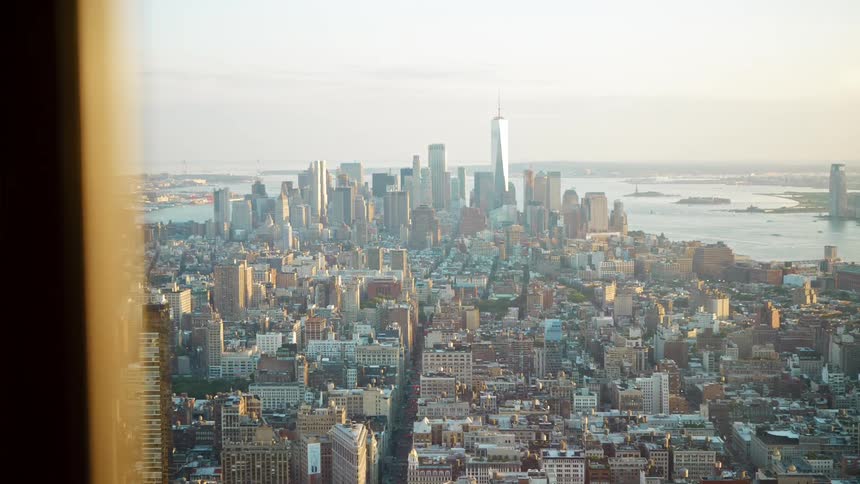 A big city skyline with skyscrapers and tall buildings seen from high rise office window