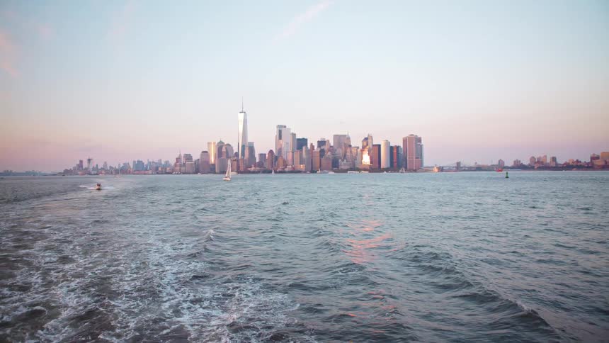 The water with boats in it and the city skyline in the background