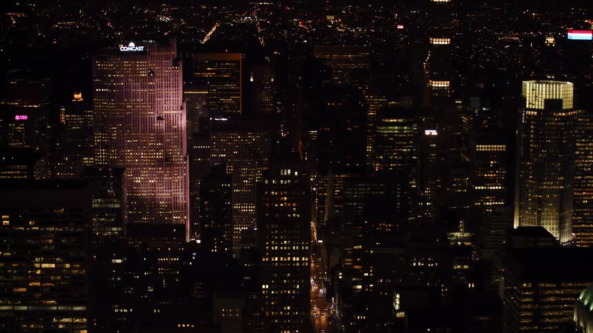 Skyscrapers lit up in a downtown area