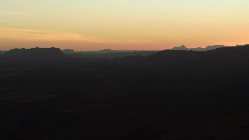 Large mountain ranges stretch into the distance