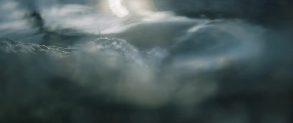 Light reflects on the surface of flowing water