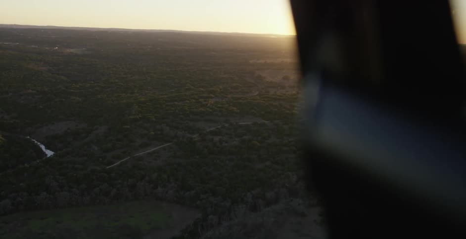 View from outside of an aircraft traveling at sunset