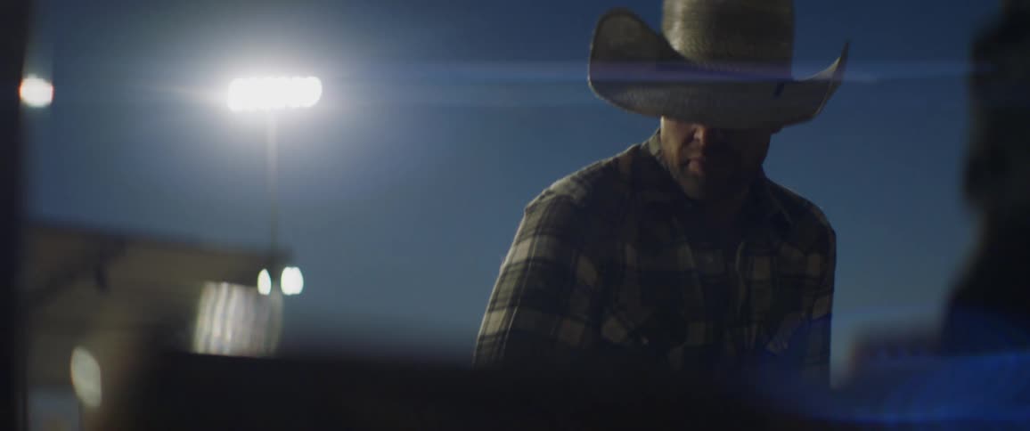 A rodeo cowboy gets ready to ride