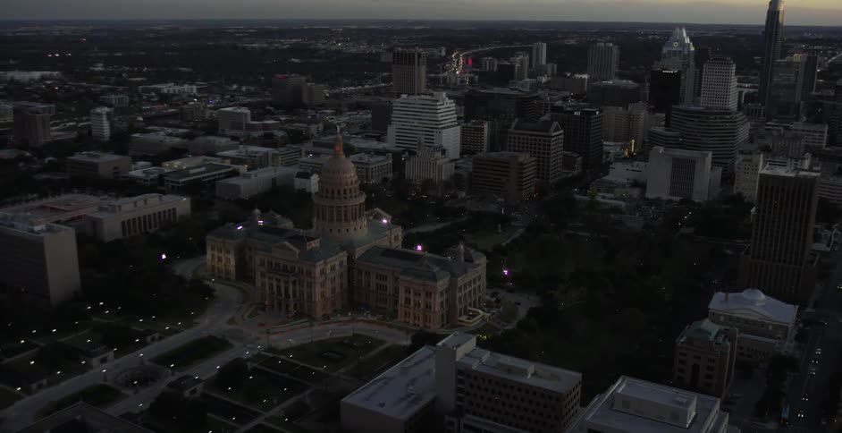 A well lit city at sunset