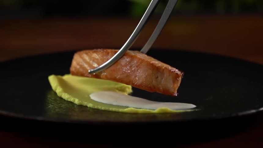 A piece of fish being plated