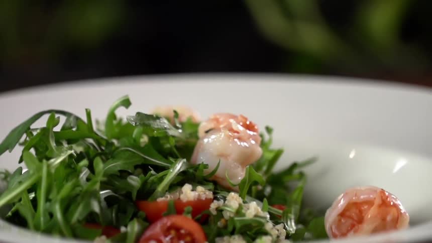 Shrimp is dropped into the salad
