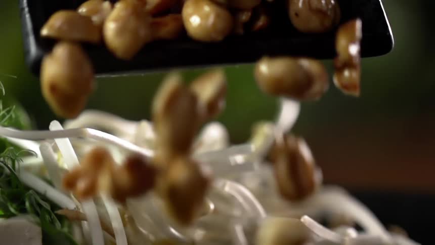 Cooked mushrooms served over sprouted beans