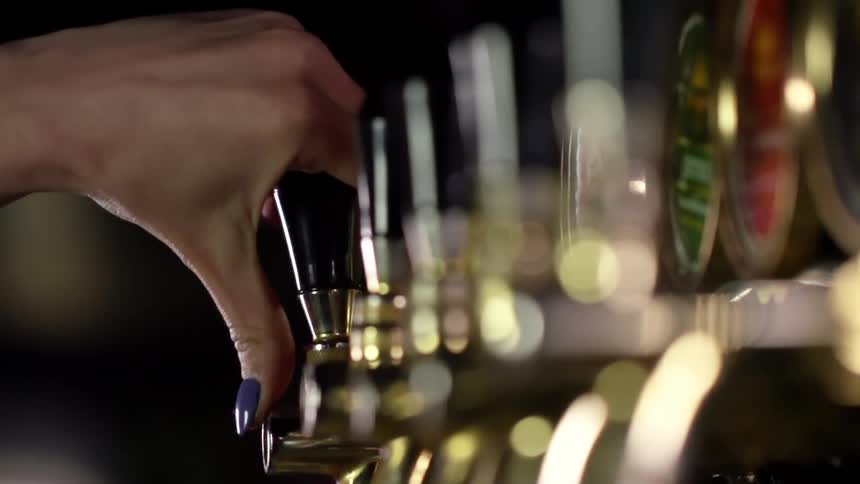 Beer is being poured from a tap