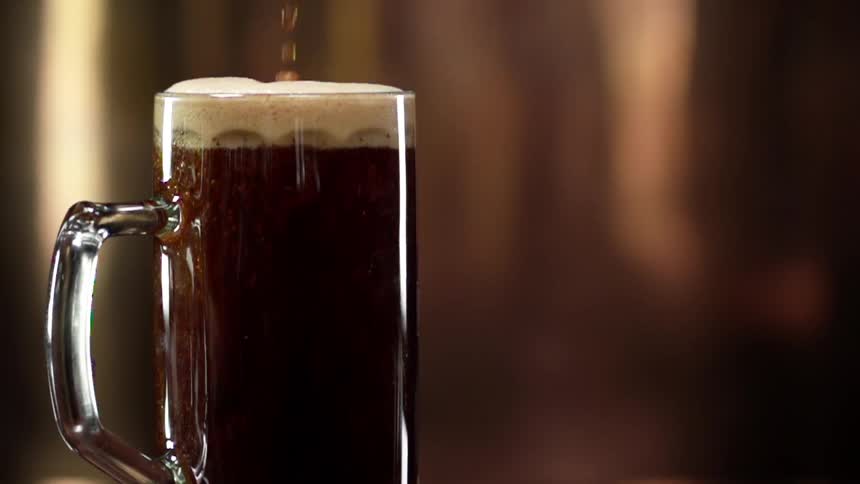 Beer being poured in to a glass