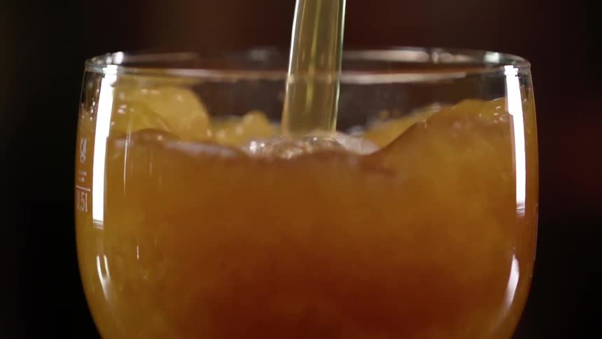 Beer being poured in to a glass