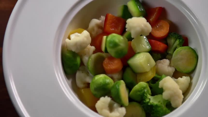 Vegetables falling in to a bowl