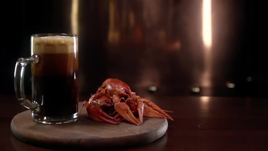 A mug sits next to a sea animal in a restaurant