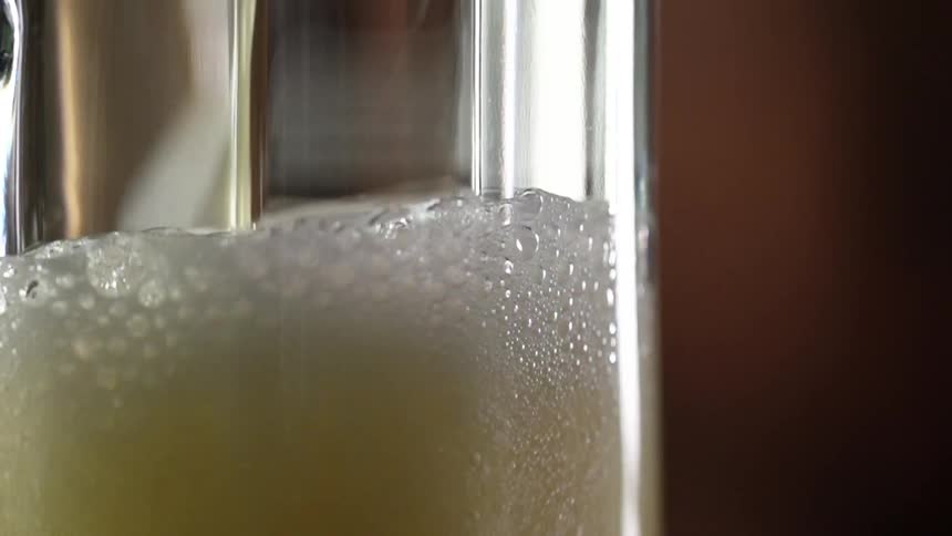 Beer being poured in to a glass