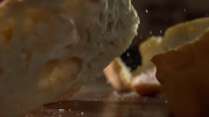 Slices of bread fall and bounce over a table