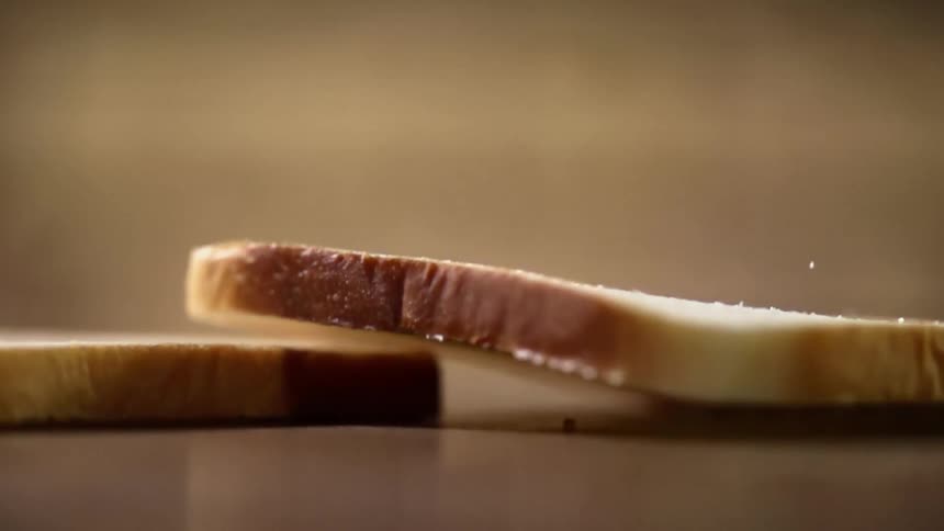 A slice of bread falls onto another slice