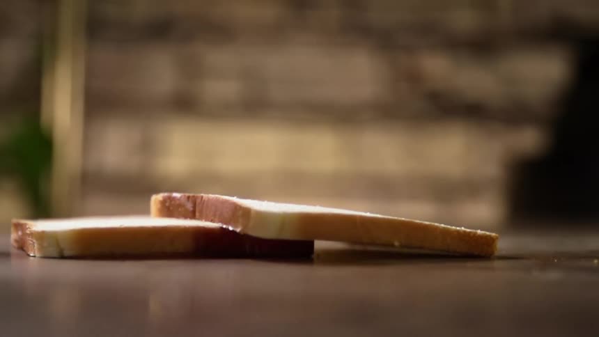 Two slices of bread fall on the ground