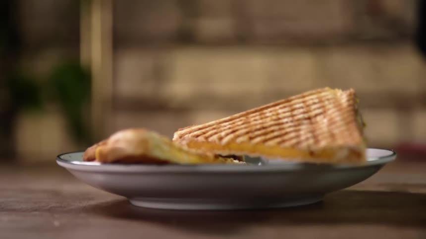 Sandwich halves are dropped on the plate