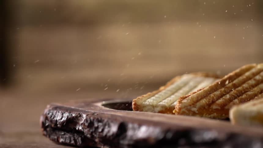 Sandwich pieces is dropped on the tray