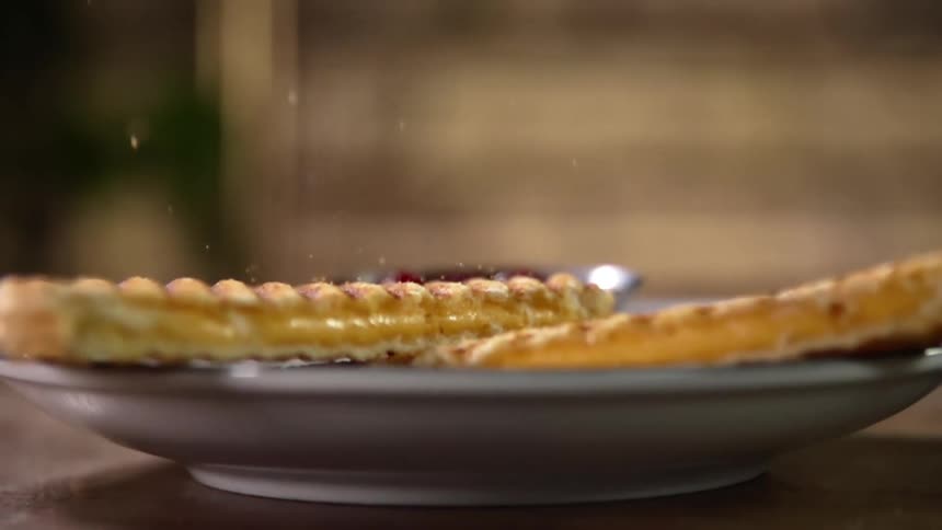 A grilled cheese sandwich falls onto a plate