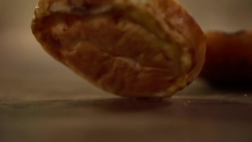 A piece of bread dropping on a counter