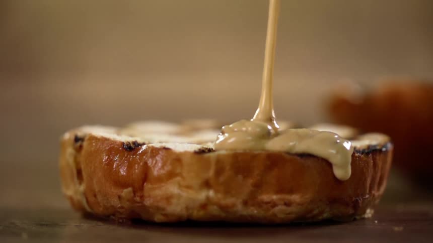 Cream is poured on the cake