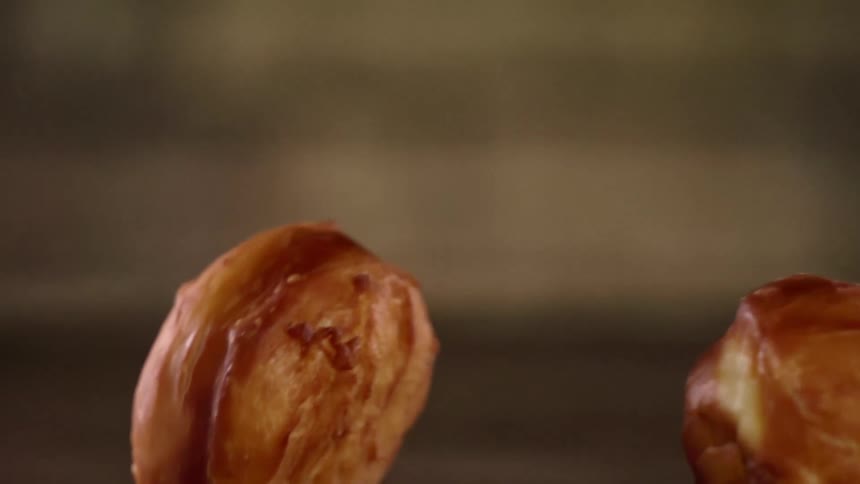 Baked goods fall and bounce on a surface