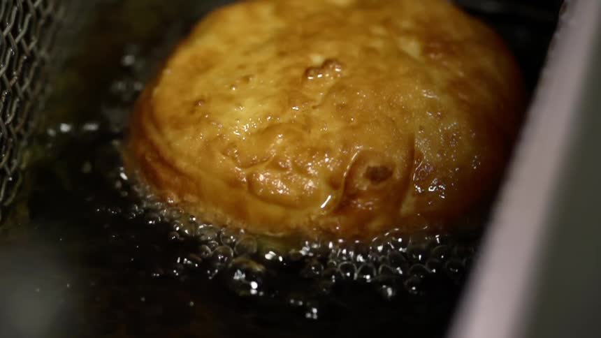 Some food frying in a fryer