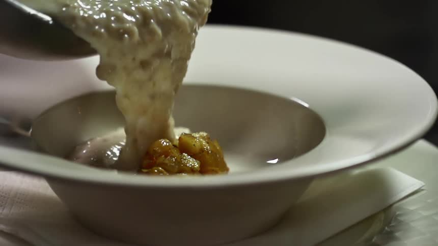 A clump of cooked apple covered in a thick gravy type sauce