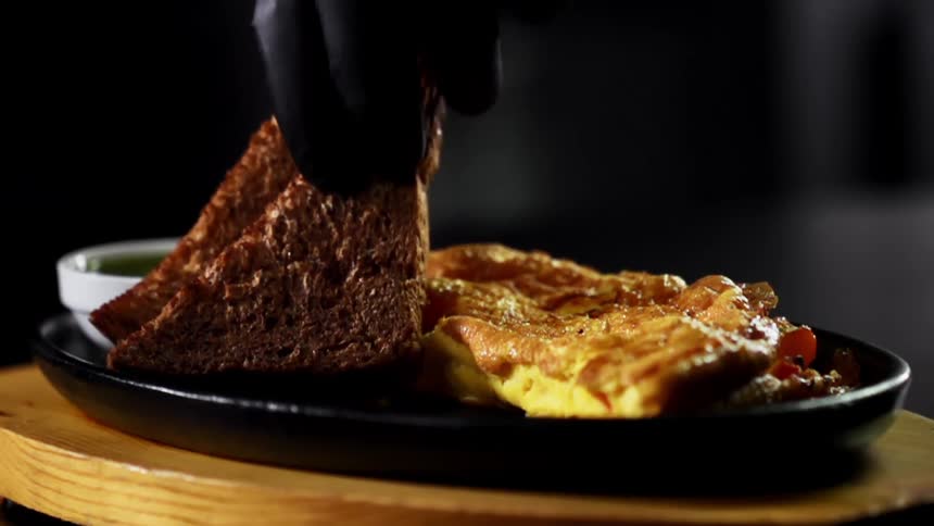 Two pieces of toast are placed on the plate