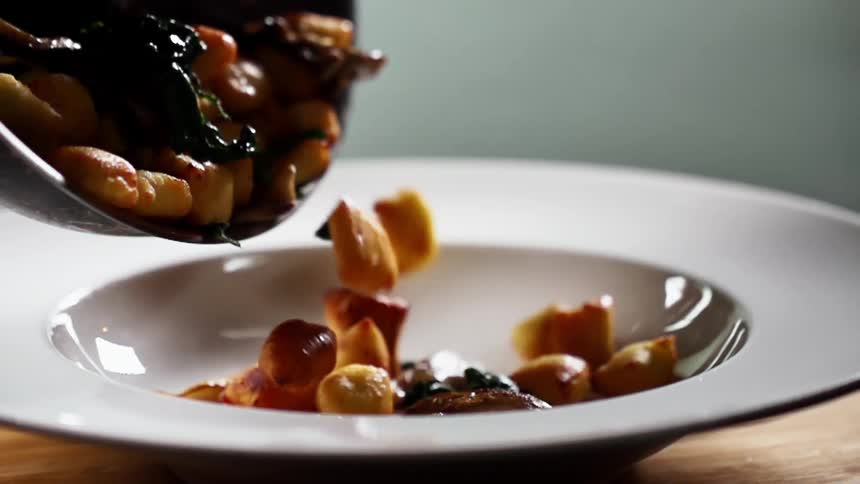 Food is emptied into the dish