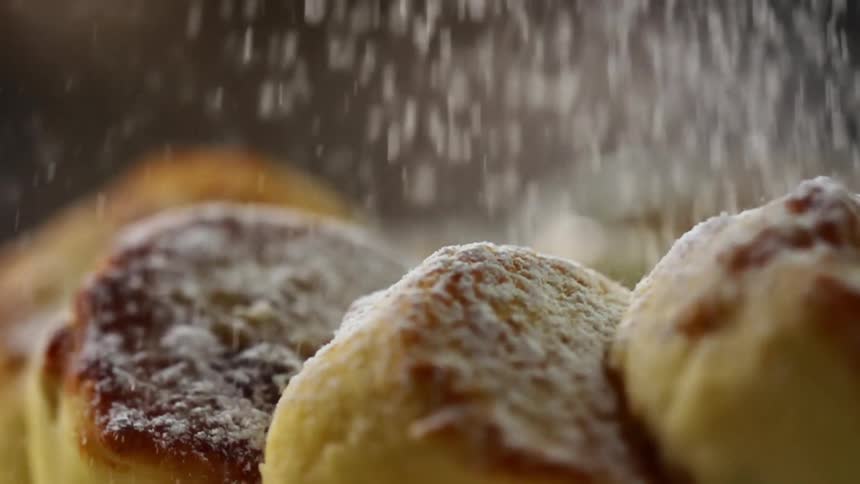 Thick coating of powdered sugar is added to pastries