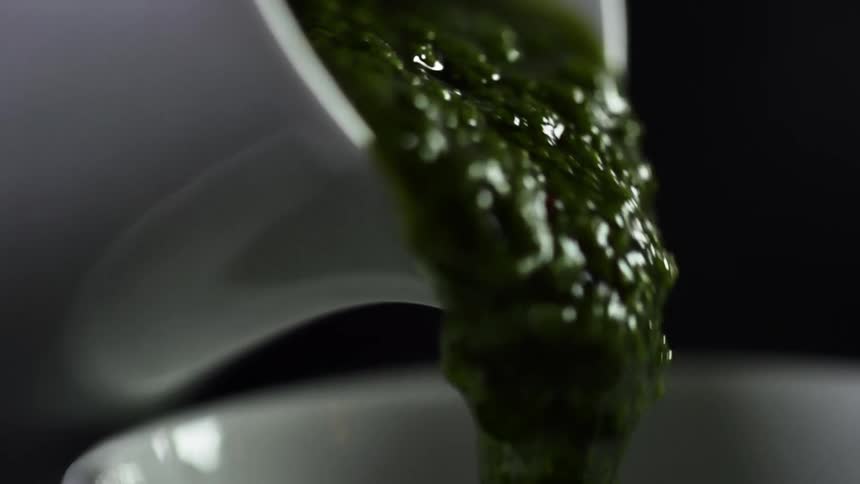 Guacamole is poured into the bowl