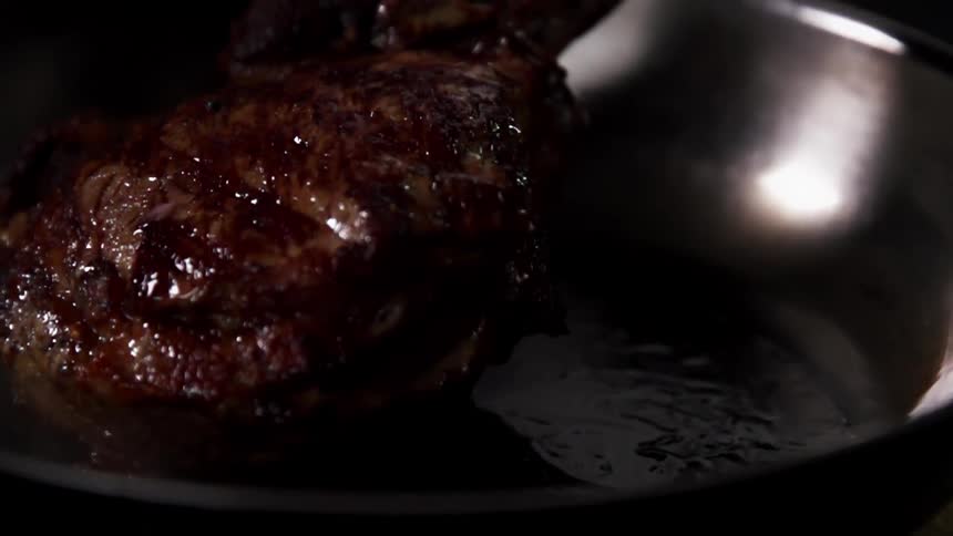 Beef is seared in a hot pan