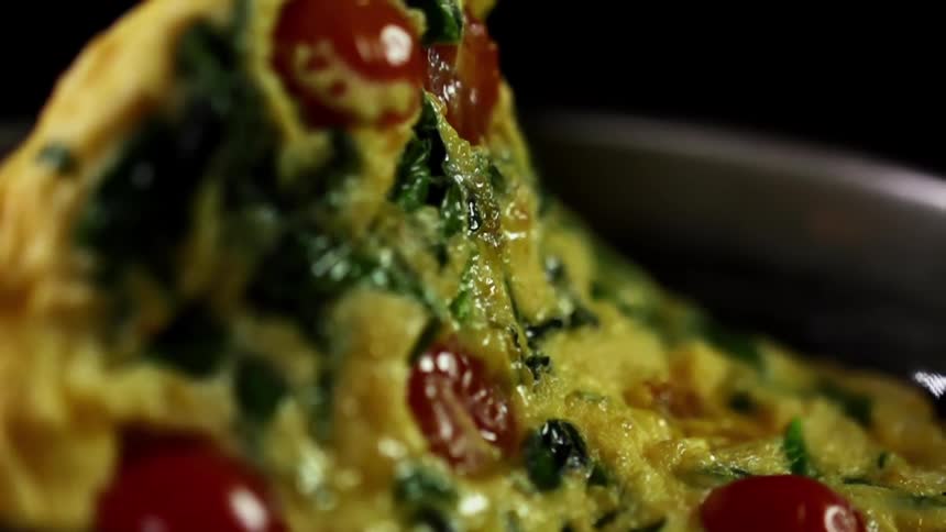 An omelette is flipped in the pan
