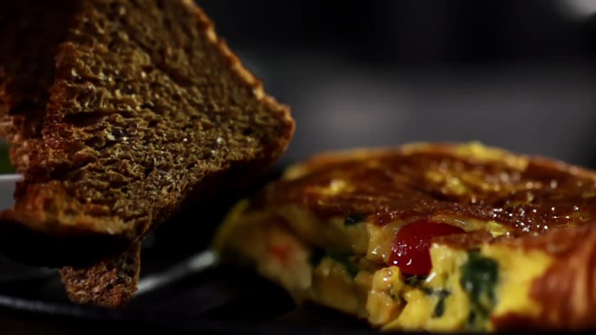 Toast is placed on a plate with an omelette