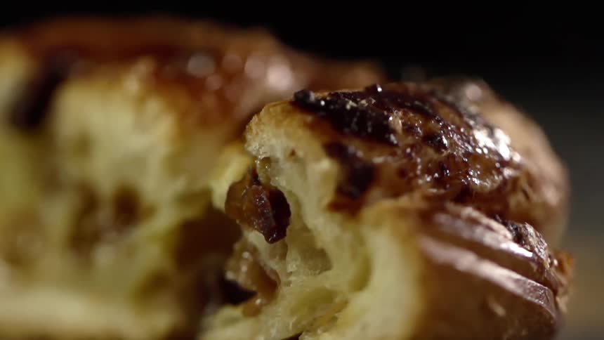 Inside of sweet pastry roll filled with raisins
