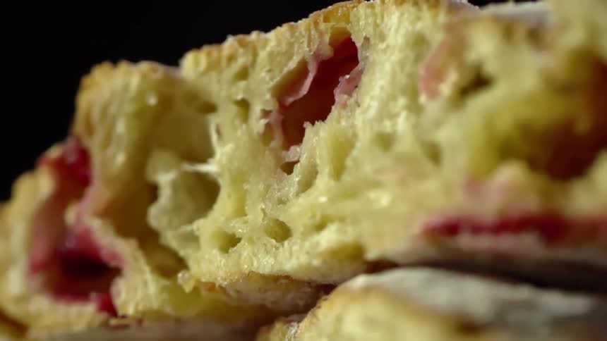 Close up shot of a dessert with raspberries in it