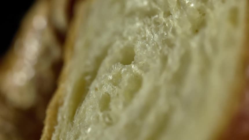 A pastry is sliced to show the interior